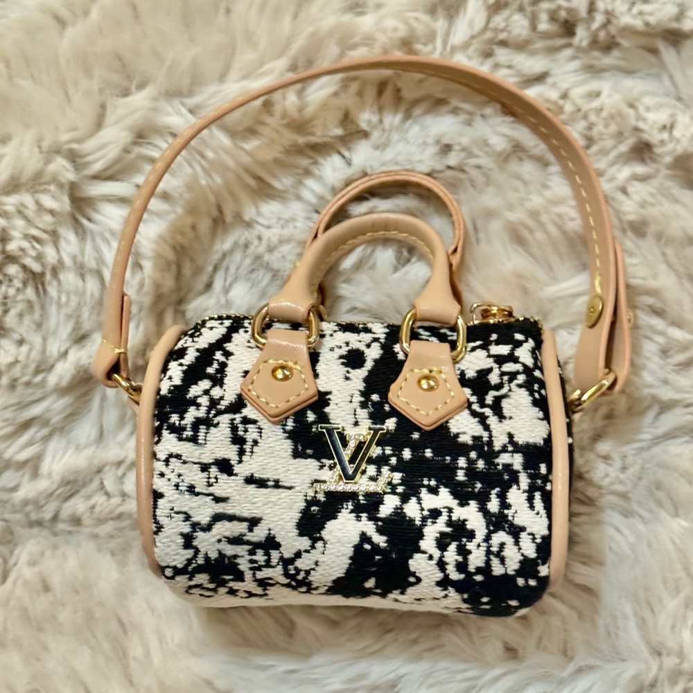 Elegant Black and White Handbag with Gold accent